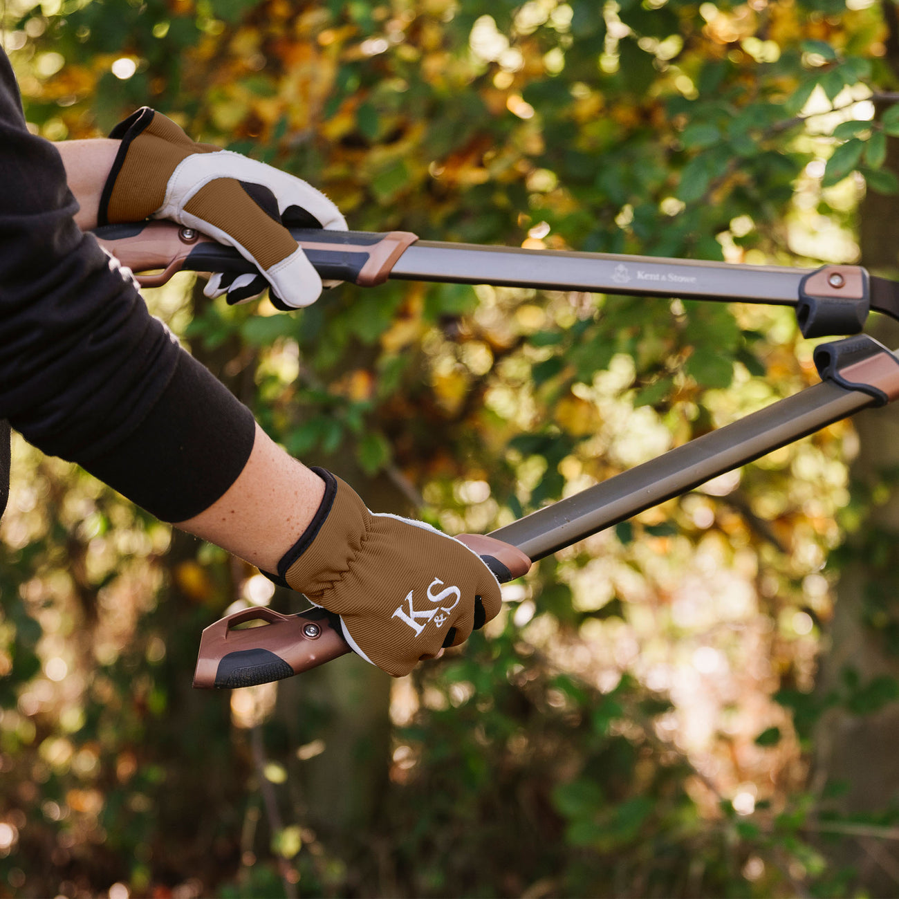 Kent & Stowe Sure & Fit Multi Job Gloves holding loppers