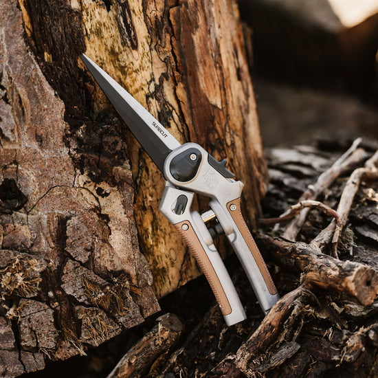 Kent & Stowe SureCut Perennial Snips leaning on wood